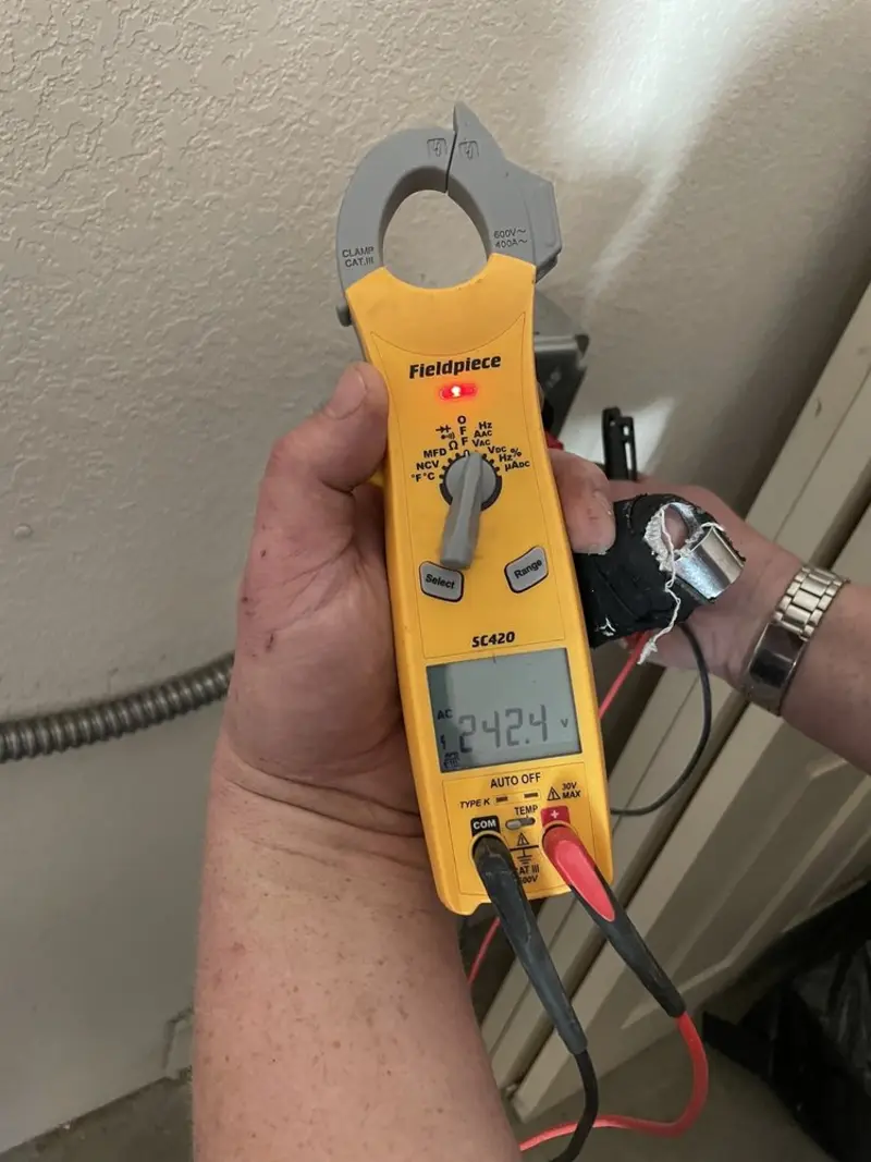 Voltage testing with clamp meter during Electrical Installation Services in Central City